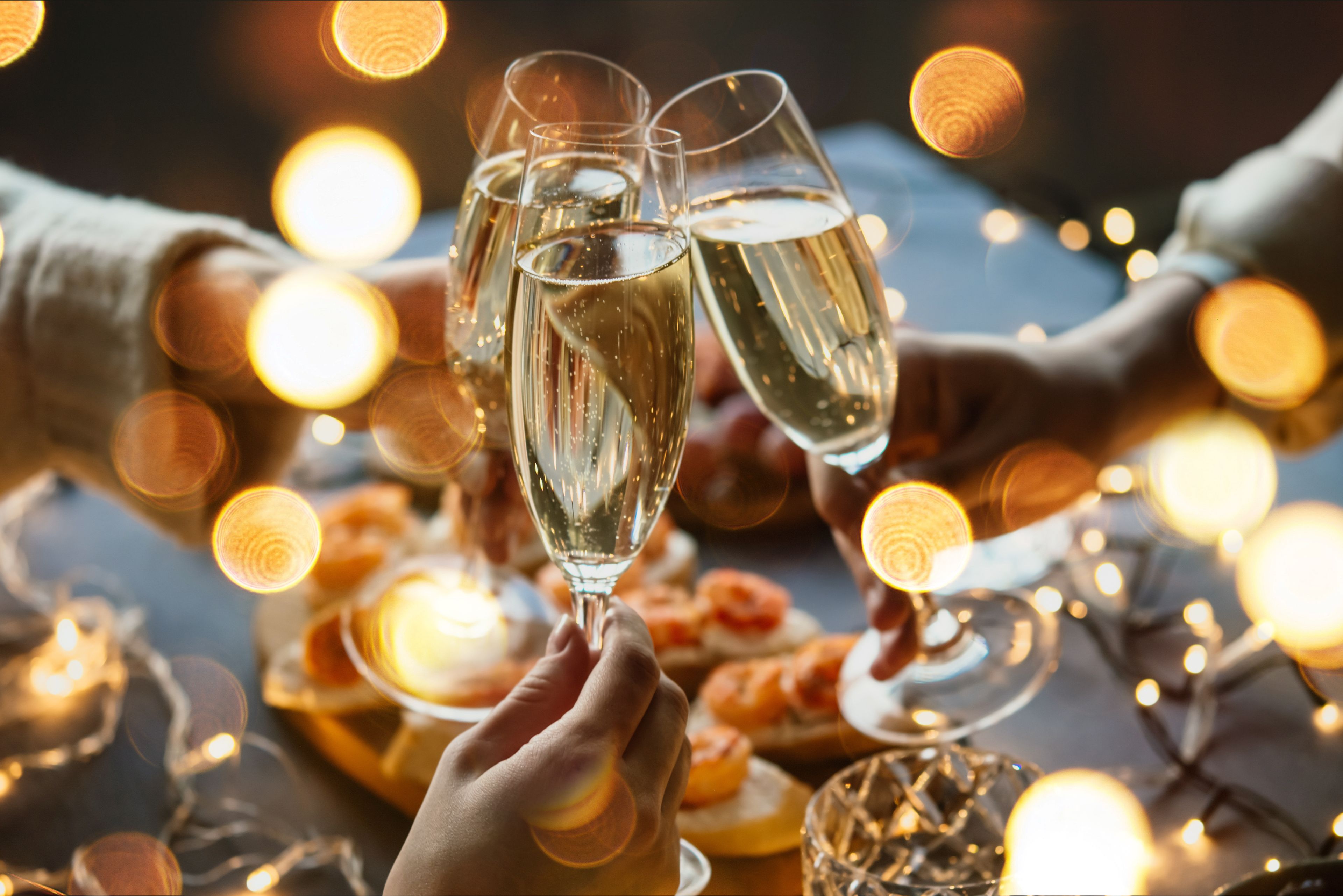 A group of people toasting with champagne glasses.