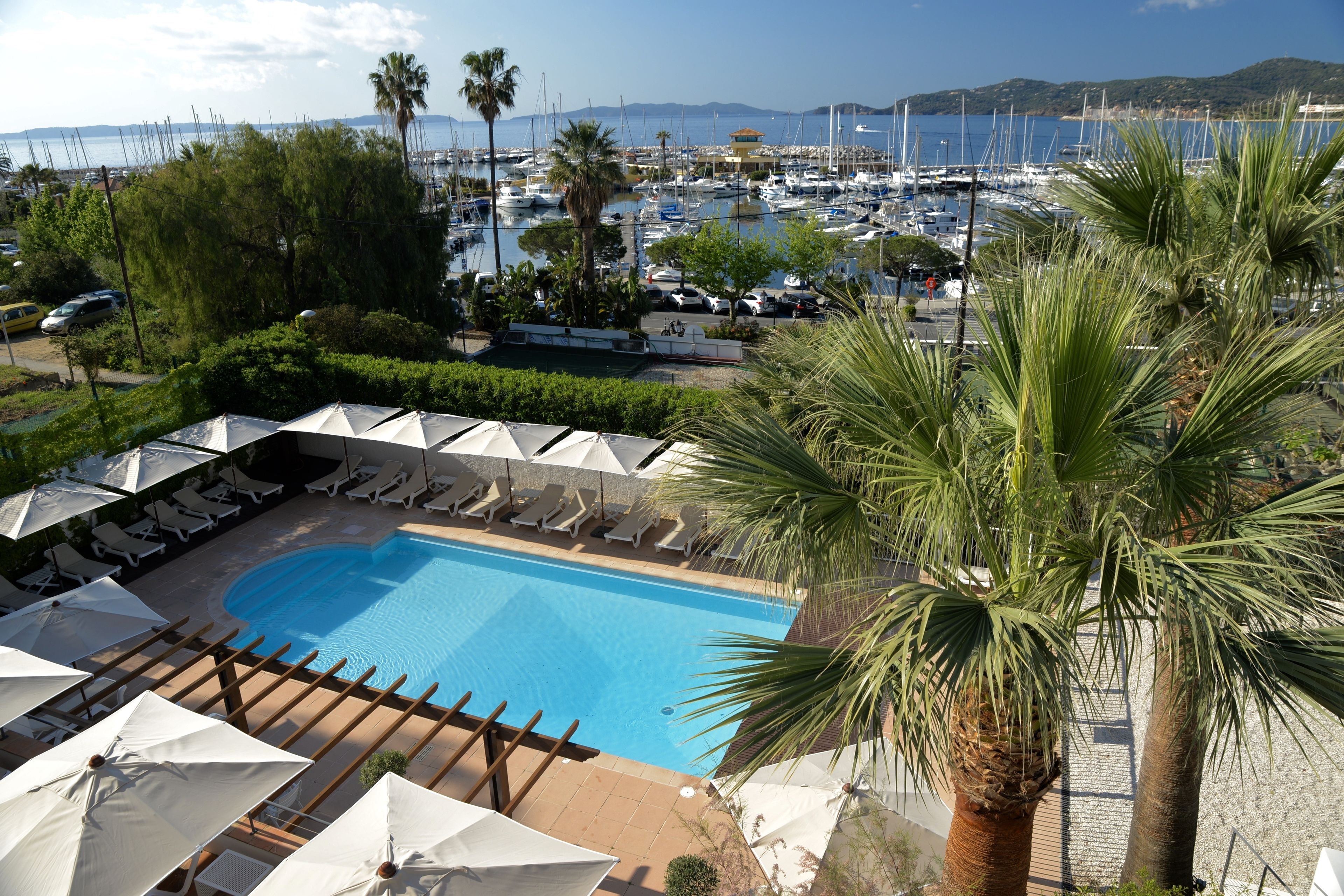 outdoor pool, pool umbrellas, pool loungers