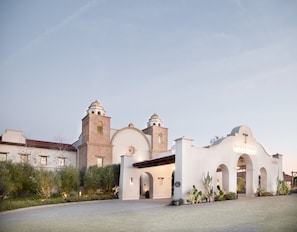 A historic building with a prominent bell tower and arched entrance, labeled "Ponte Inn."
