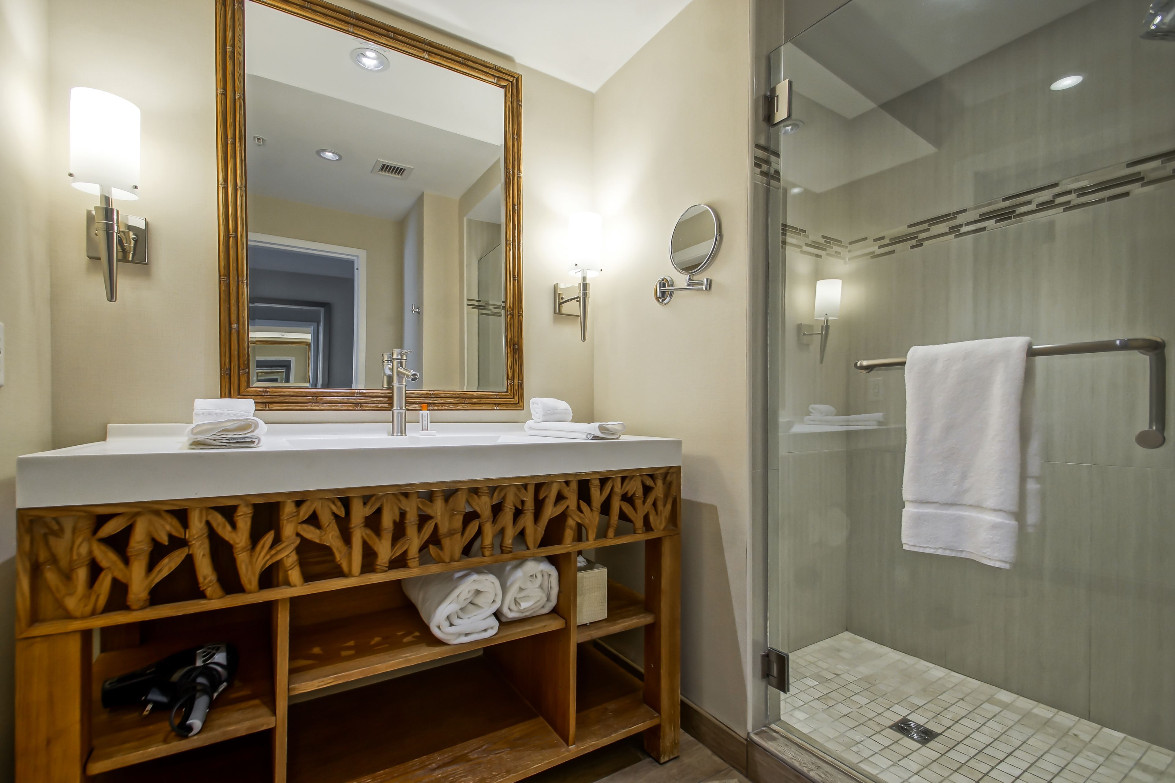 shower, designer toiletries, hair dryer, towels