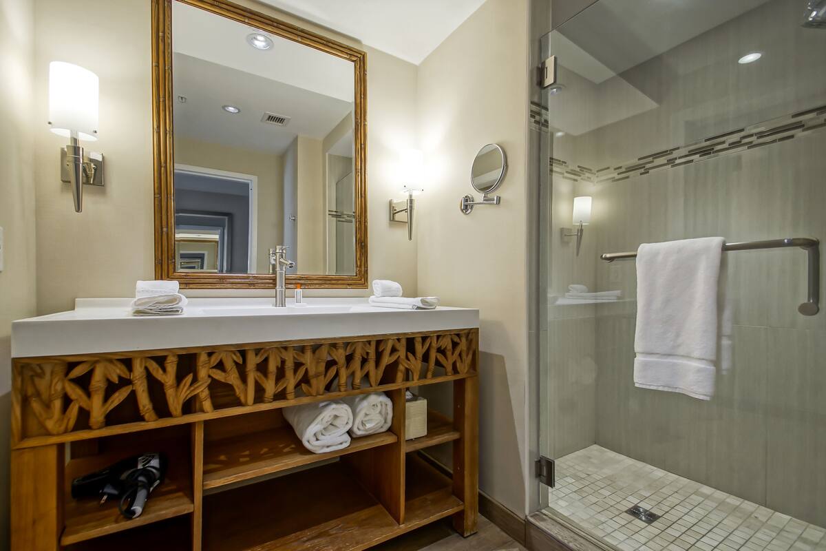 shower, designer toiletries, hair dryer, towels