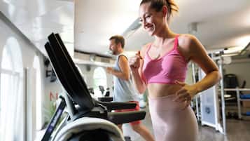 A gym with treadmills and exercise equipment.