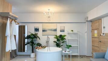 Premium Room, 1 King Bed, Non Smoking, Bathtub | Living area | 50-inch Smart TV with cable channels, TV