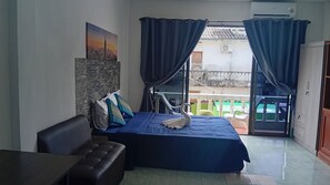 Family Quadruple Room, Kitchen, Garden Area | Hypo-allergenic bedding, in-room safe, desk, laptop workspace - The Guest House - SHA (Patong)