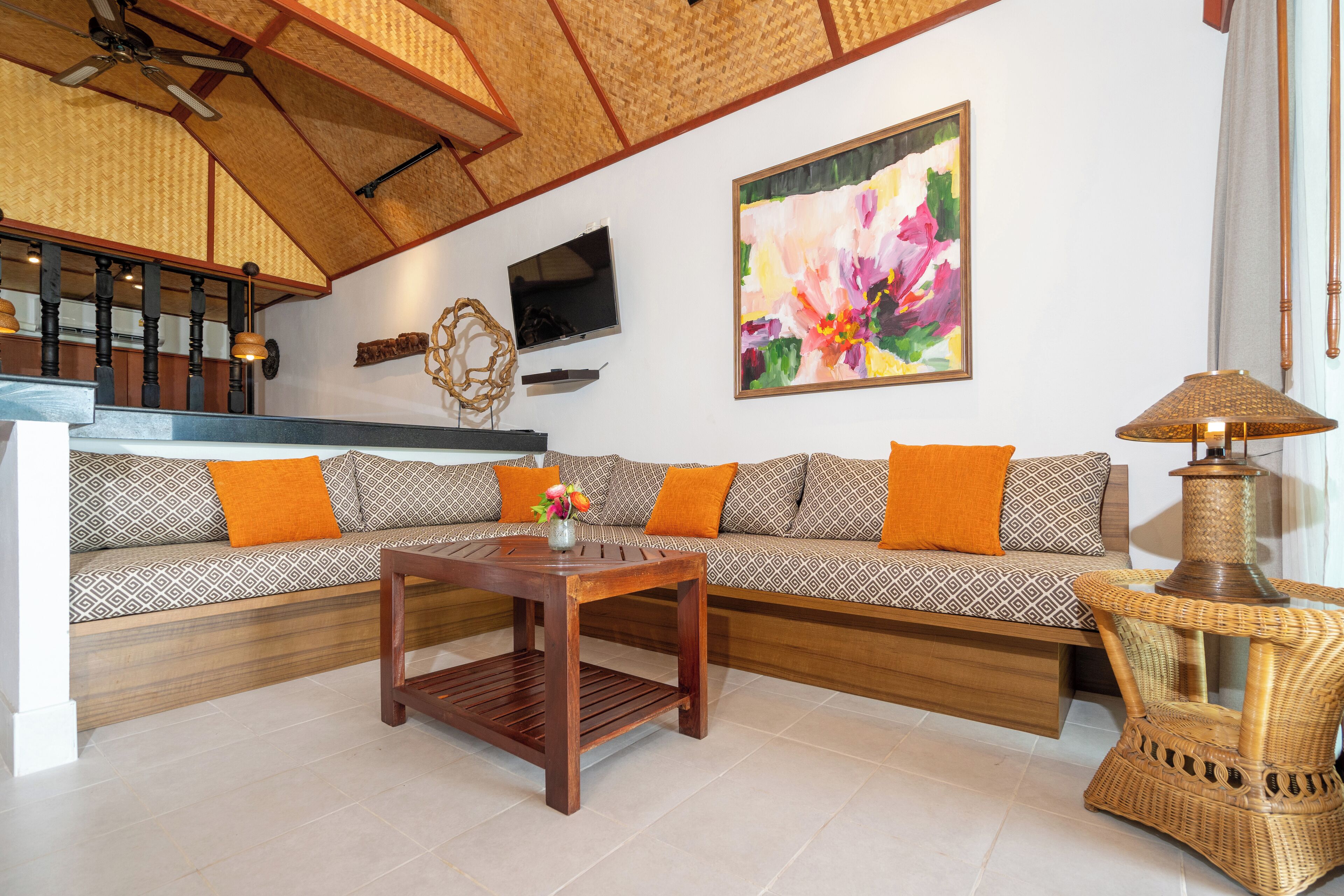 suite, beachfront | living area | 24-inch flat-screen tv with satellite channels