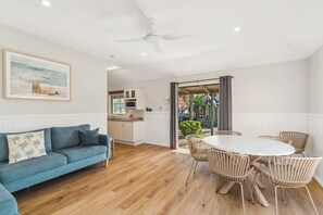 Deluxe 3 Bedroom Cabin | Living area | Flat-screen TV, ping pong