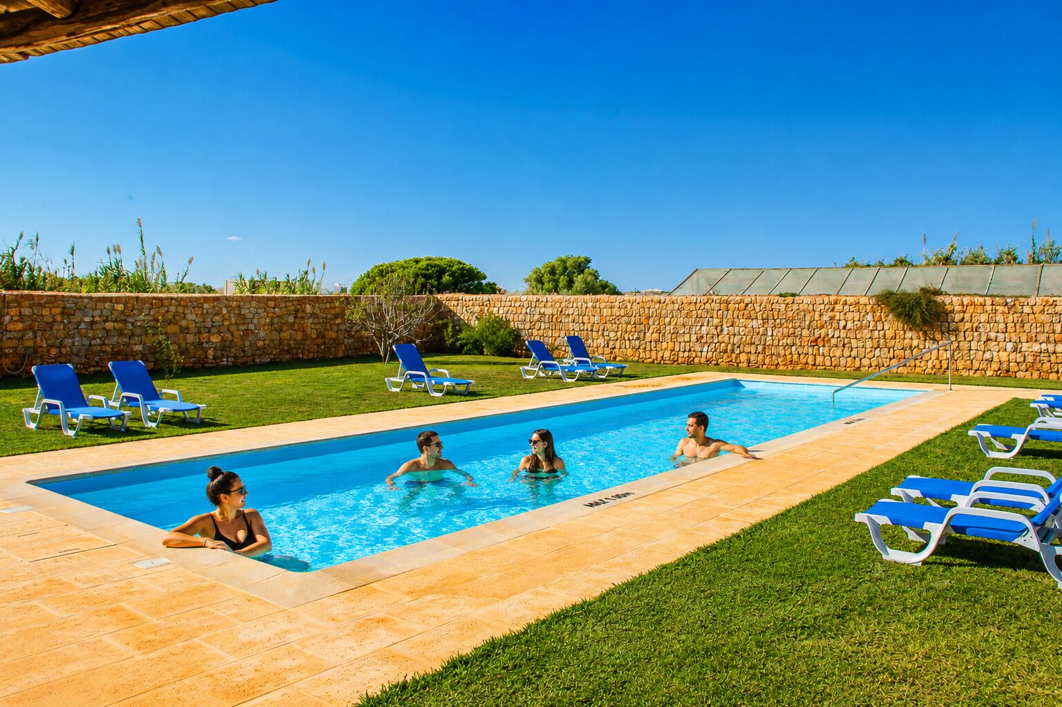 Seasonal outdoor pool, pool loungers