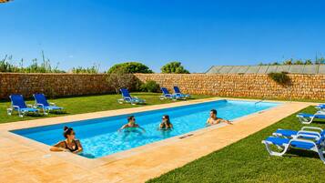 Seasonal outdoor pool, pool loungers