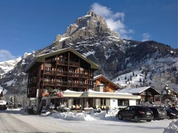 Experience the tranquility of this mountain lodge, surrounded by snow-covered slopes and serene natural beauty.