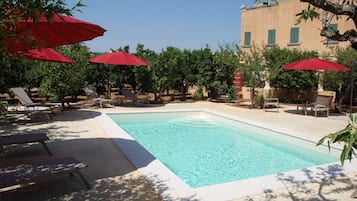 Seasonal outdoor pool, open 9:00 AM to 7:00 PM, pool umbrellas