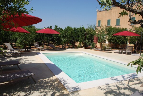 Seasonal outdoor pool, open 9:00 AM to 7:00 PM, pool umbrellas