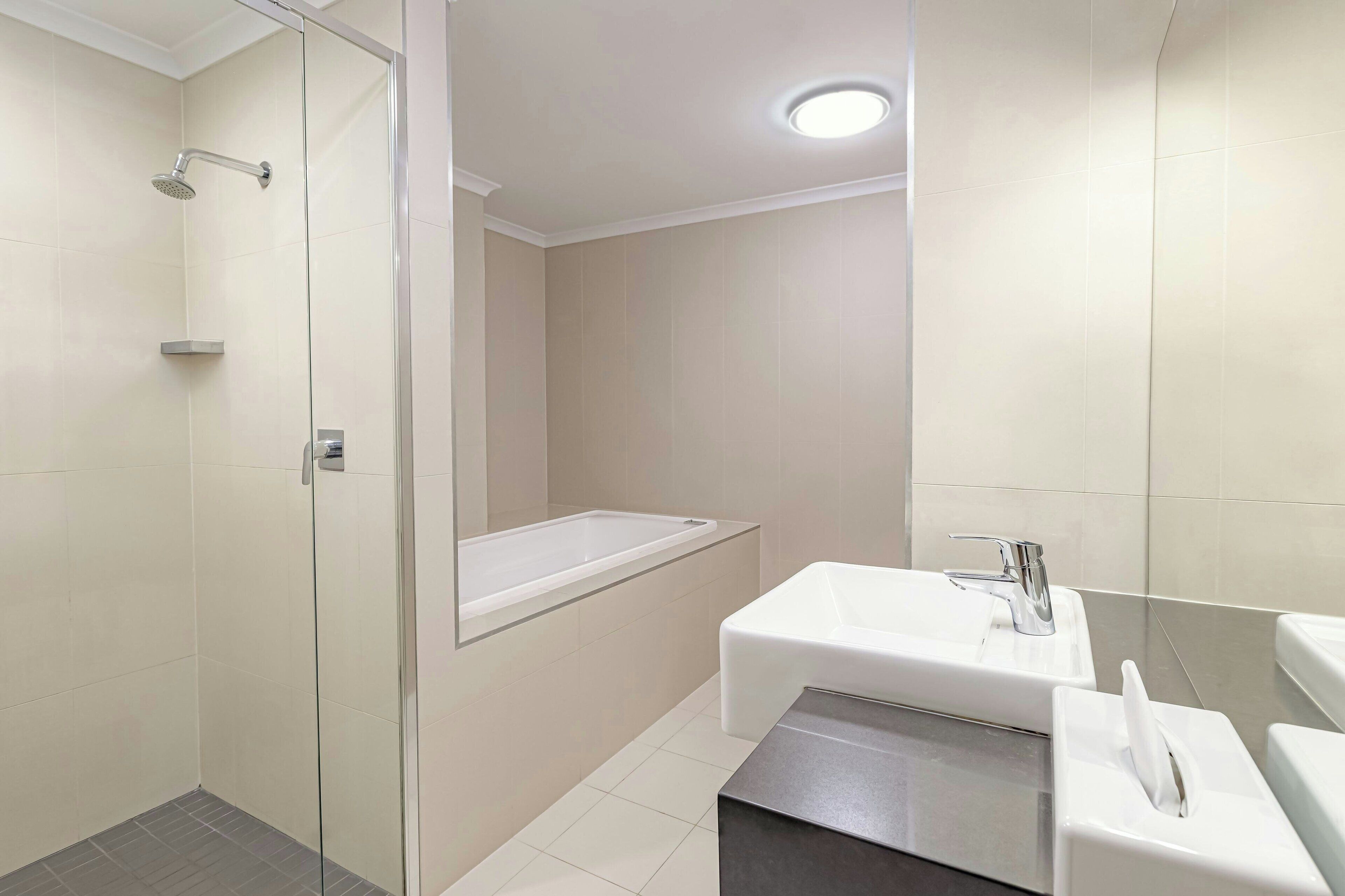 Deluxe Room, 1 King Bed with Sofa bed | Bathroom | Shower, hair dryer, towels, soap