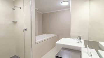 Deluxe Room, 1 King Bed with Sofa bed | Bathroom | Shower, hair dryer, towels, soap
