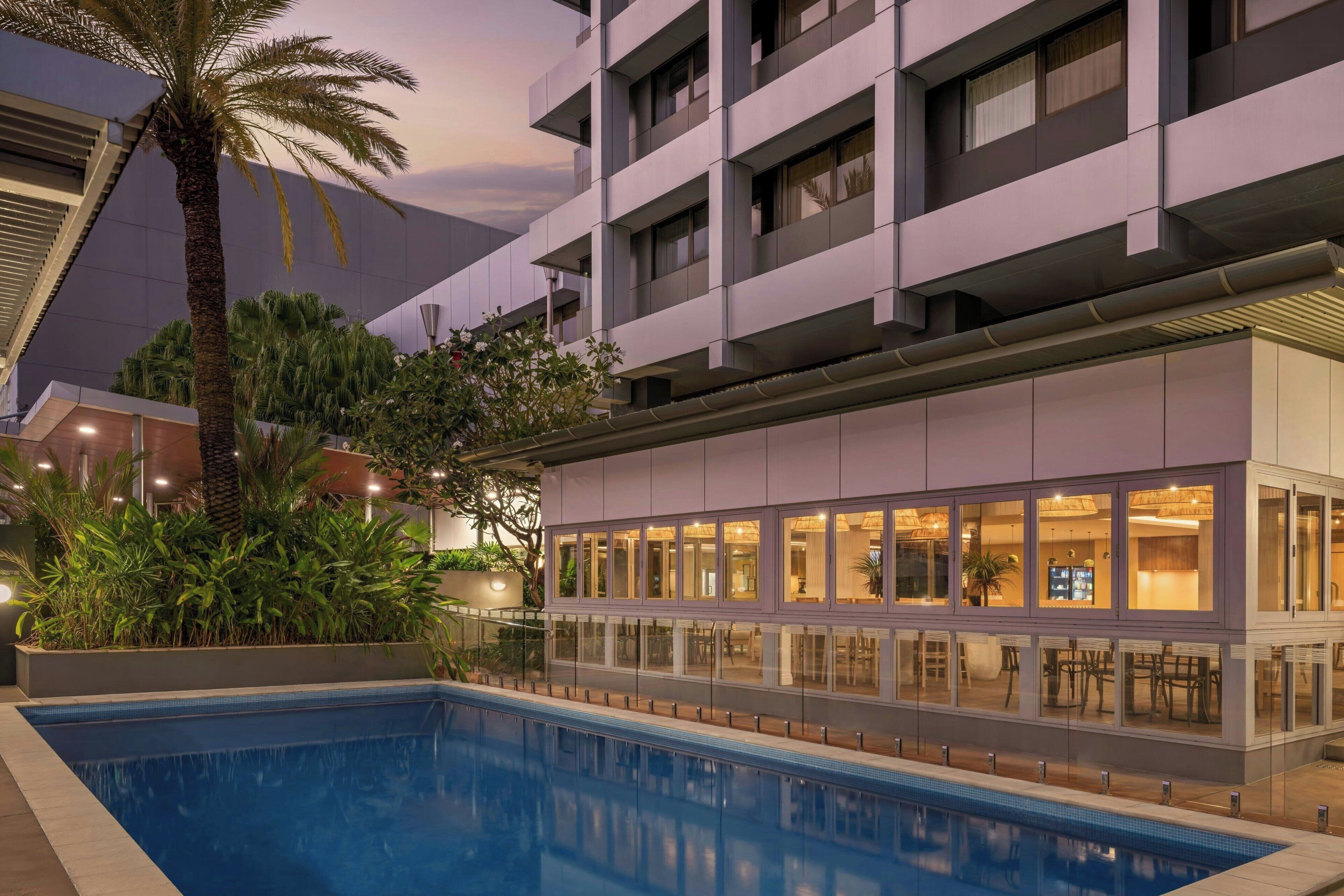 Outdoor pool, open 6:00 AM to 9:00 PM, pool loungers