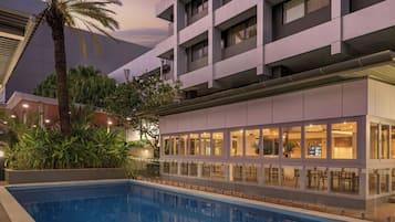 Outdoor pool, open 6:00 AM to 9:00 PM, pool loungers