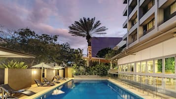 Outdoor pool, open 6:00 AM to 9:00 PM, pool loungers