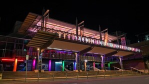 A modern building with a large illuminated sign reading "DARWIN'S INNOVATION CENTRE". - Courtyard By Marriott Darwin (Darwin)