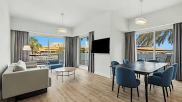 Senior Suite, 3 Bedrooms | Living area | 42-inch TV with satellite channels