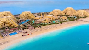 A coastal hotel with multiple buildings, a beach, and a swimming pool. - Rixos Bab Al Bahr - All inclusive (Ras Al Khaimah)