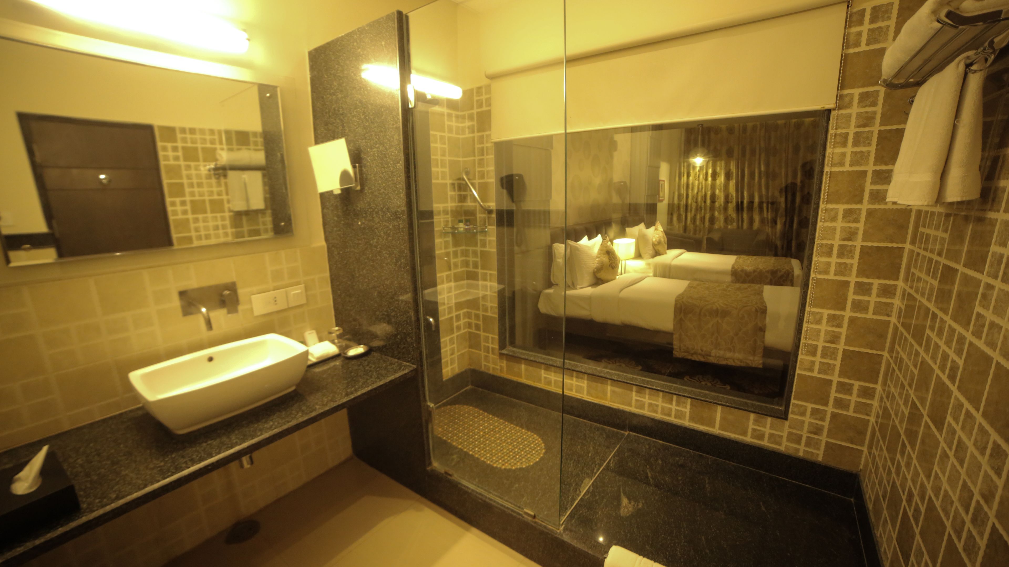 deluxe room | bathroom | designer toiletries, hair dryer, bathrobes, slippers
