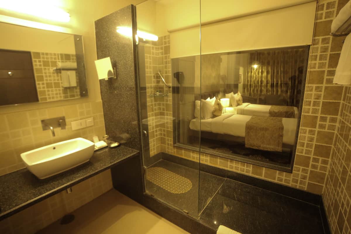 deluxe room | bathroom | designer toiletries, hair dryer, bathrobes, slippers