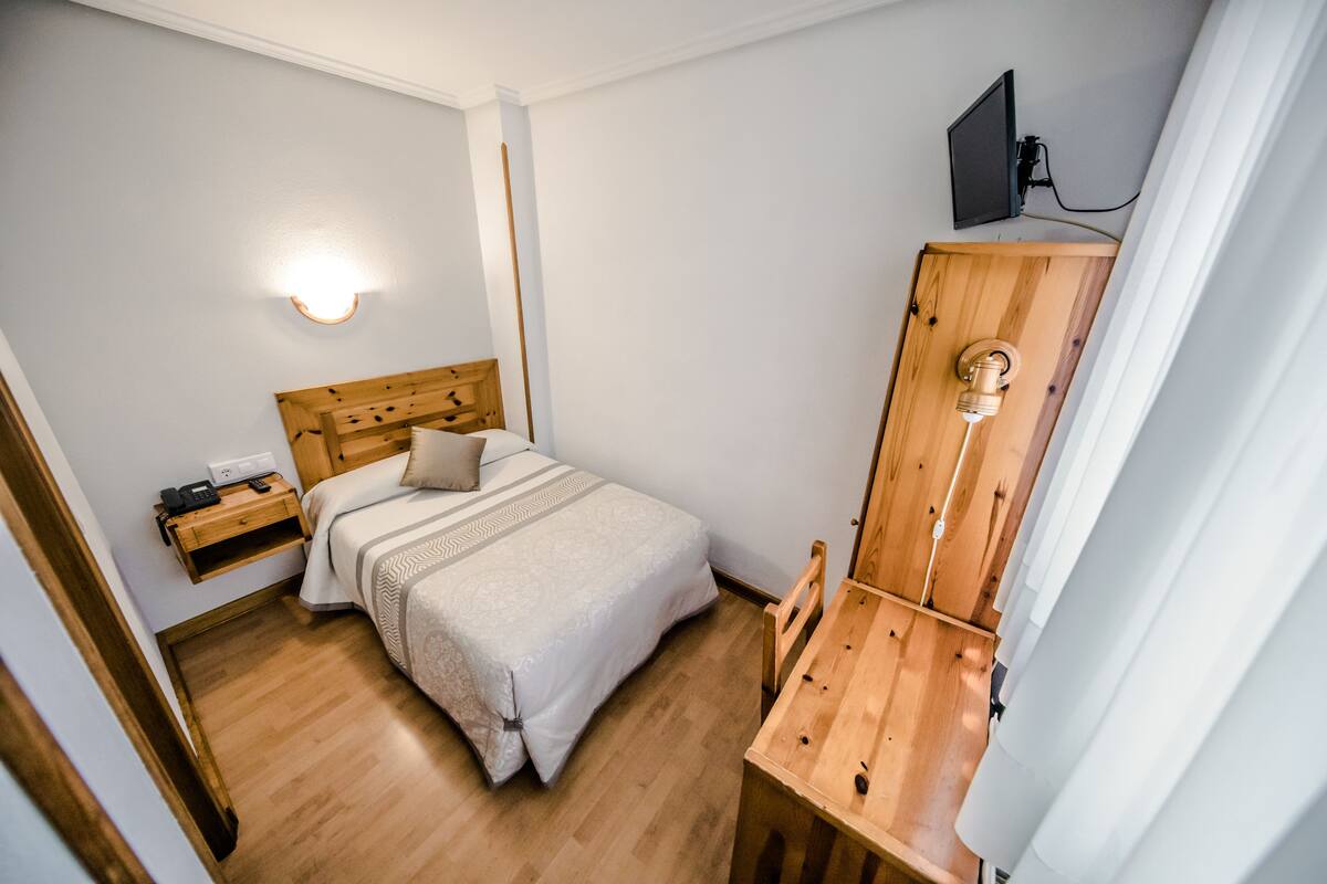 Single Room | Desk, blackout drapes, iron/ironing board (on request), travel crib