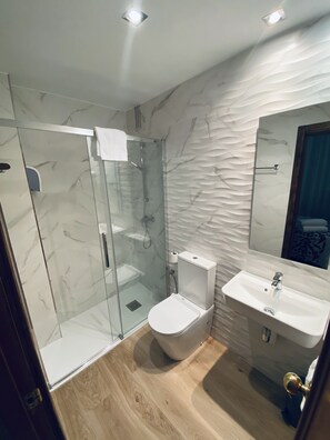 Shower, free toiletries, hair dryer, towels