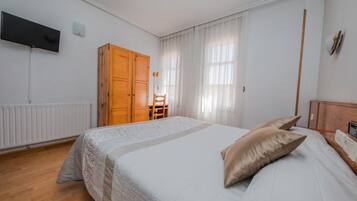 Double Room | Desk, blackout drapes, iron/ironing board, travel crib