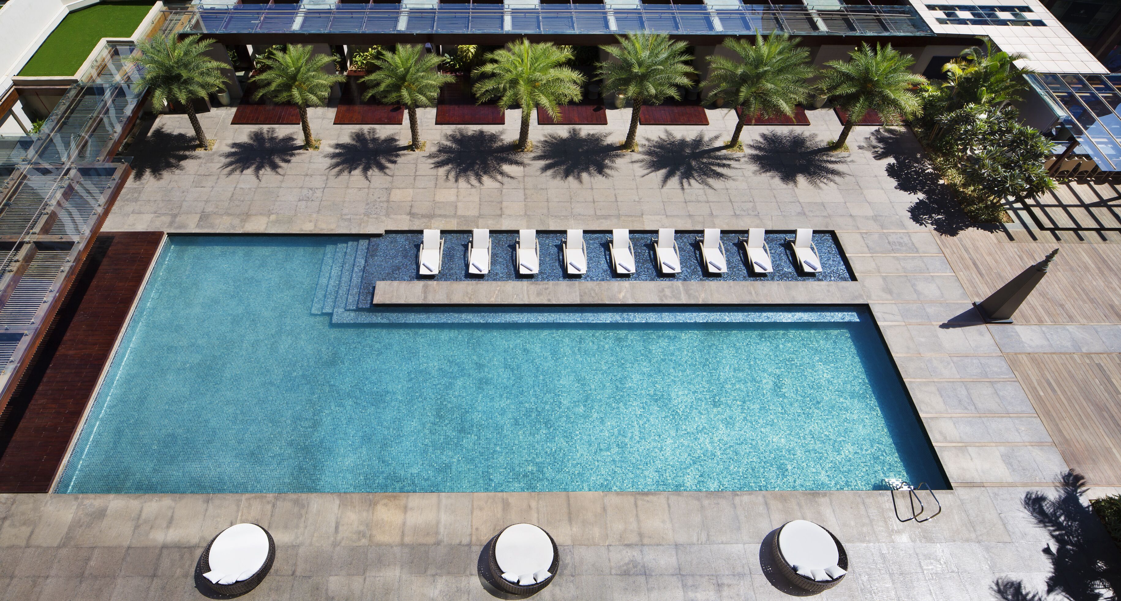 Outdoor pool, open 8:00 AM to 7:00 PM, pool umbrellas, pool loungers