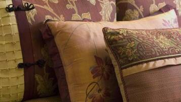 A close-up of a sofa with patterned cushions.