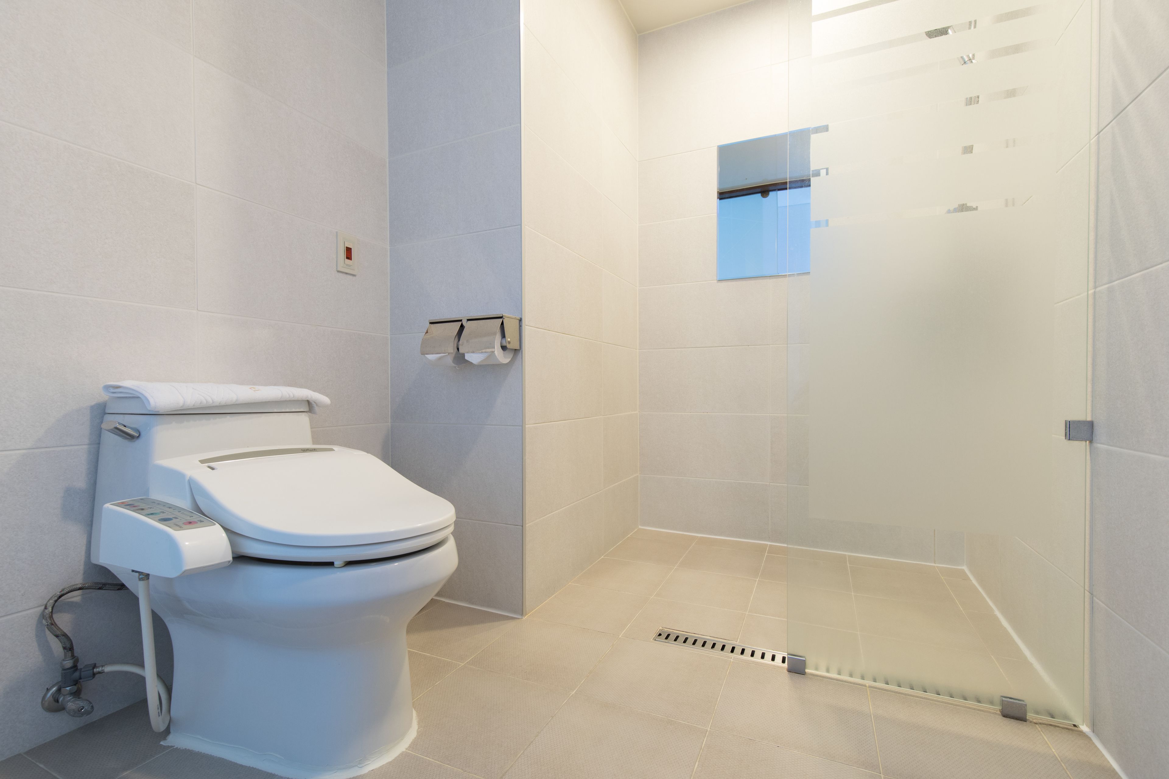 deluxe double room | bathroom | hair dryer, bathrobes, bidet, towels