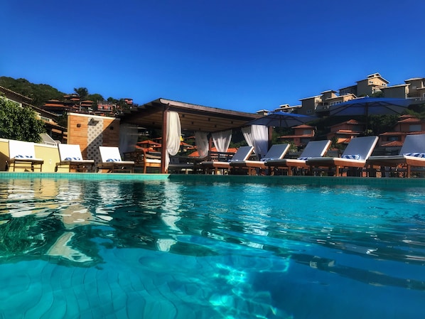Outdoor pool, open 9 AM to 10 PM, pool umbrellas, pool loungers