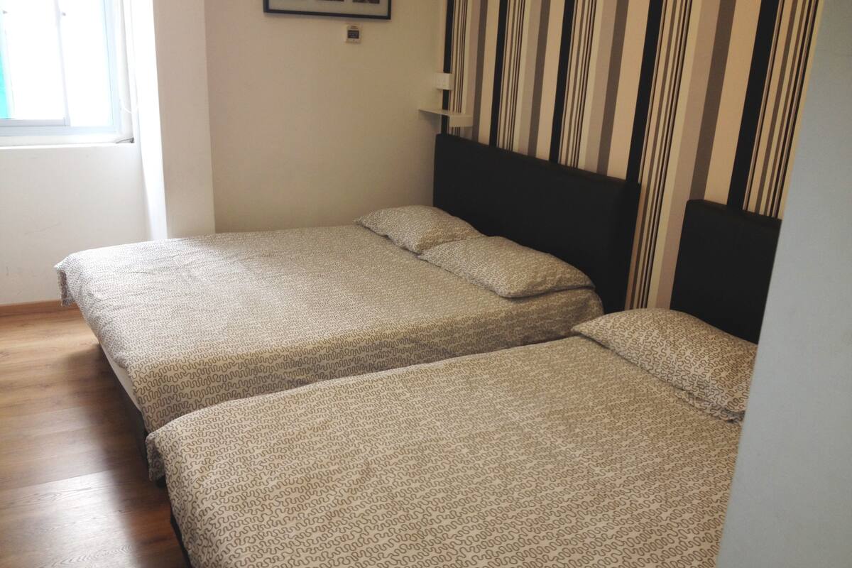 Family Room, 2 Queen Beds | Iron/ironing board (on request), WiFi (free)