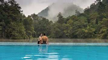 Outdoor pool, open 10:00 AM to 7:30 PM, pool umbrellas, pool loungers