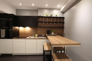 Apartment (Yellow/Black) | Private kitchen | Full-size fridge, microwave, stovetop, coffee/tea maker