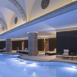 Indoor pool, open 7:00 AM to 7:00 PM, lifeguards on site