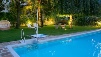 Seasonal outdoor pool, open 8:30 AM to 8:00 PM, pool loungers