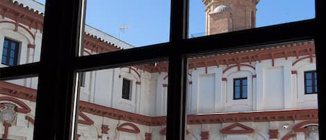 A building with a clock tower and arched windows.