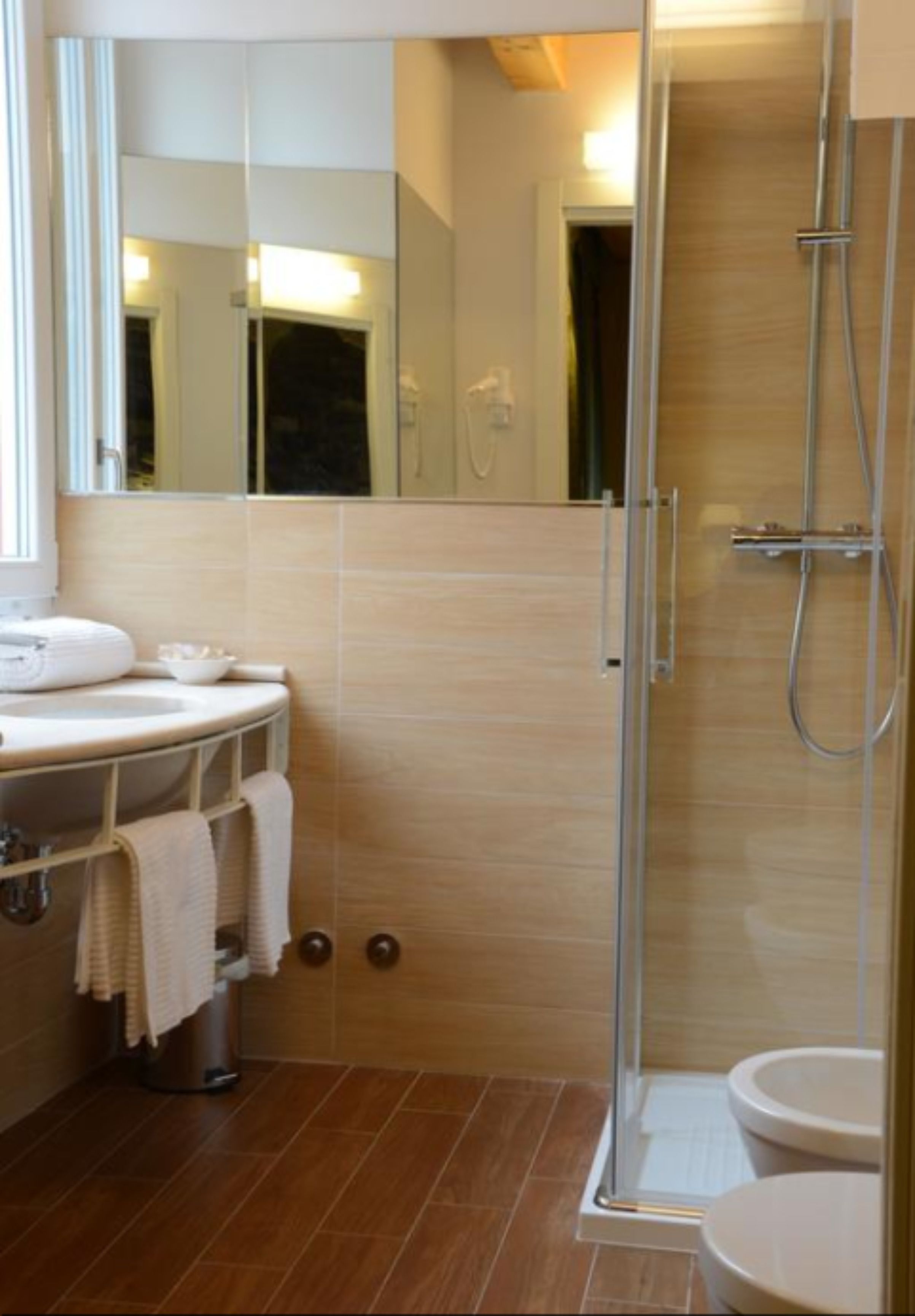 shower, hair dryer, bidet, towels