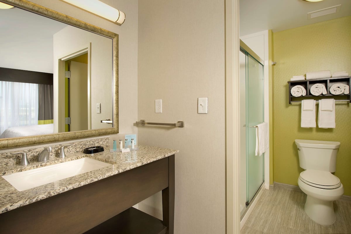 studio suite, 1 king bed | bathroom | free toiletries, towels
