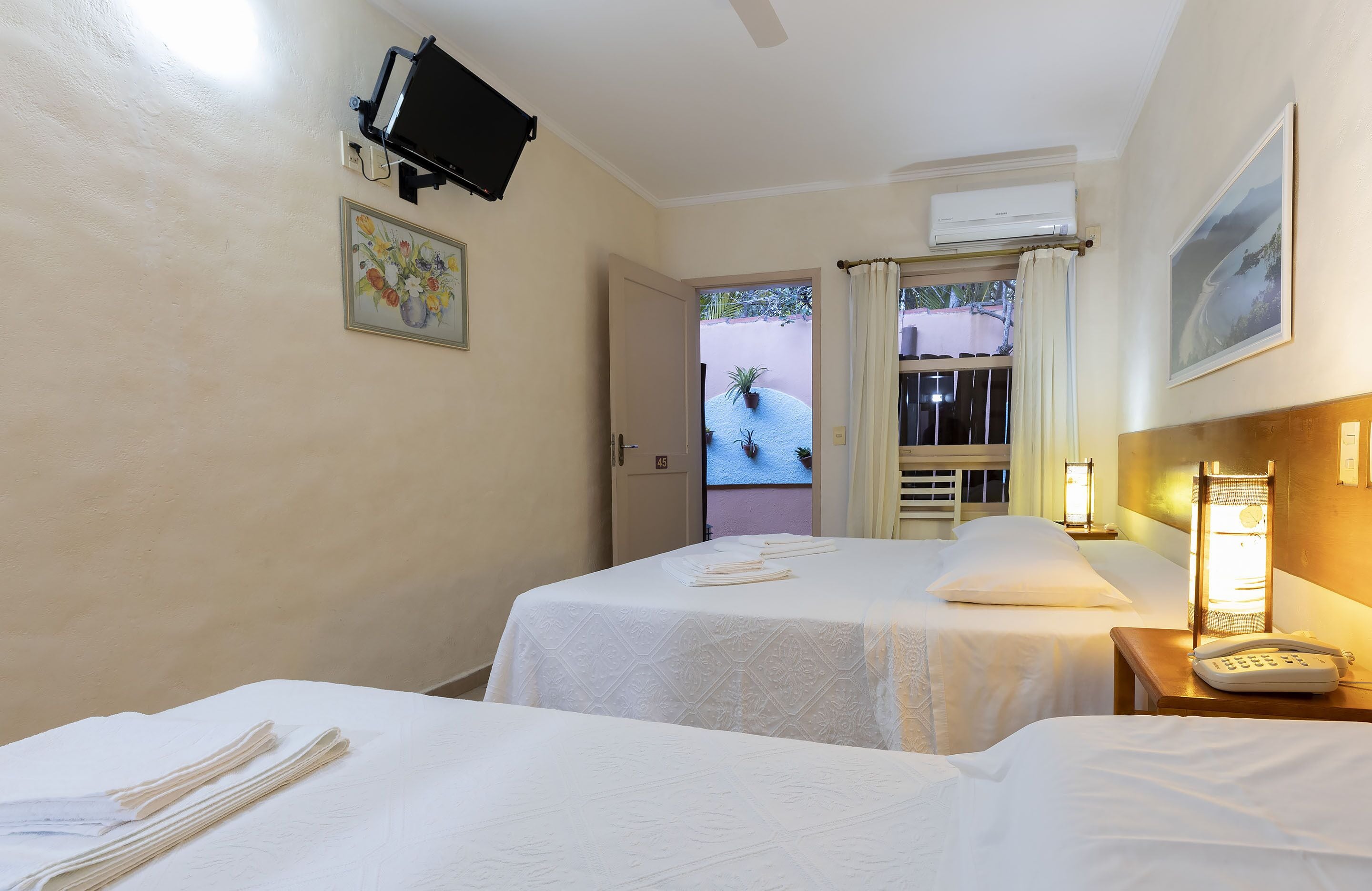 luxury triple room  | pillow-top beds, minibar, in-room safe, individually decorated