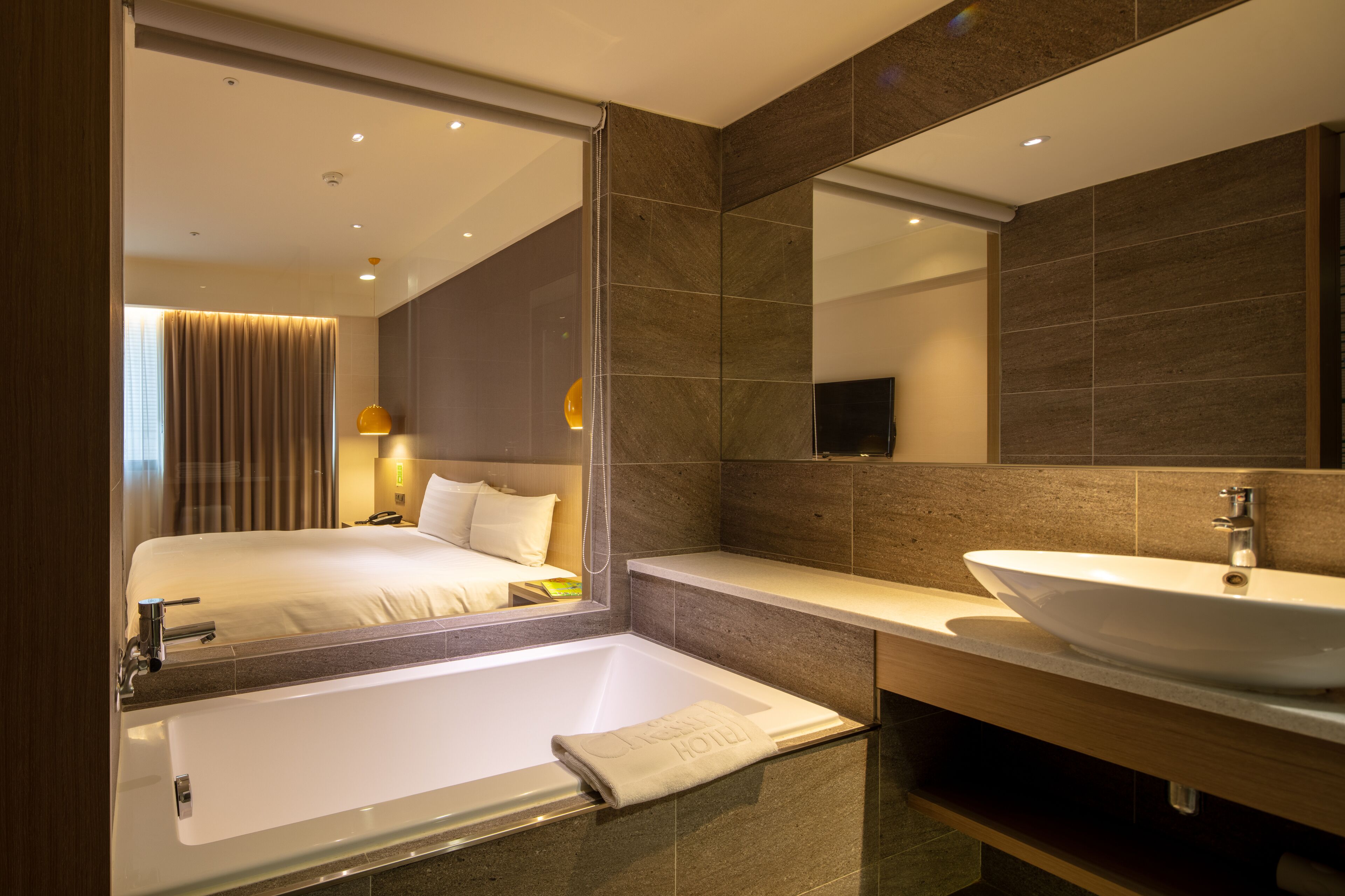 deluxe double room | bathroom | hair dryer, slippers, towels, shampoo