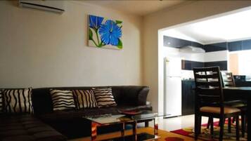 Deluxe Apartment, 1 Bedroom | Living room | TV