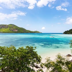 On the beach, white sand, beach umbrellas, beach towels