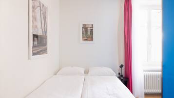 Premium bedding, desk, blackout drapes, soundproofing