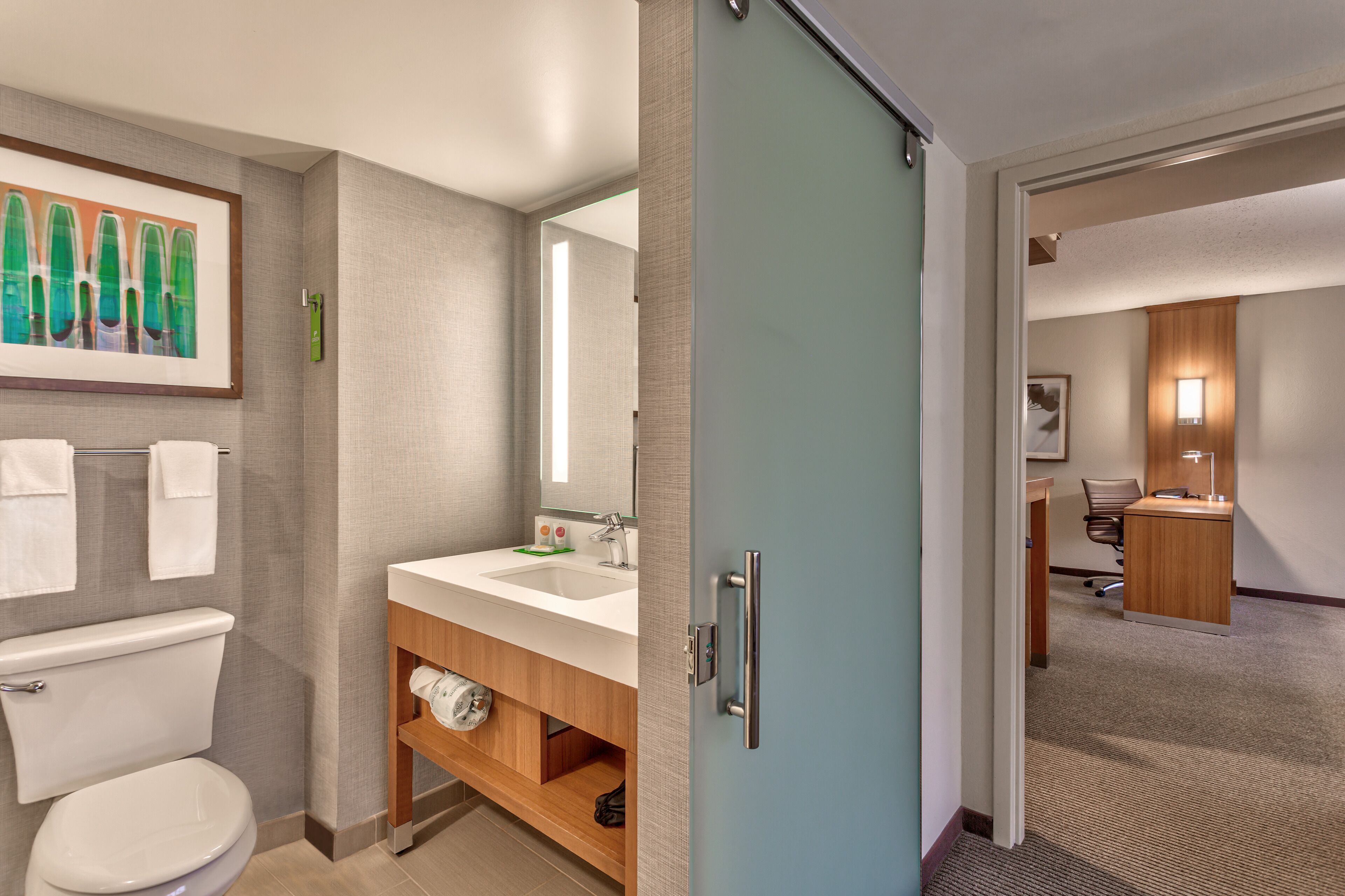 designer toiletries, hair dryer, towels