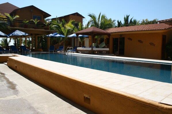 Seasonal outdoor pool, pool umbrellas, pool loungers