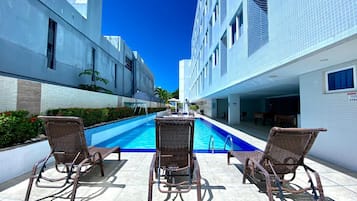 Outdoor pool, pool umbrellas, sun loungers