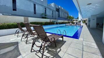 Outdoor pool, pool umbrellas, sun loungers