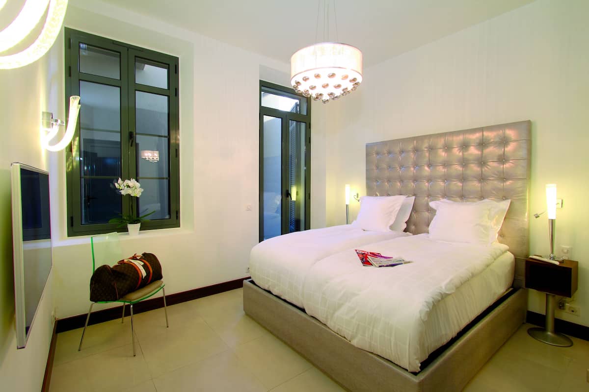 Apartment, 2 Bedrooms, Patio | Premium bedding, pillowtop beds, in-room safe, individually decorated
